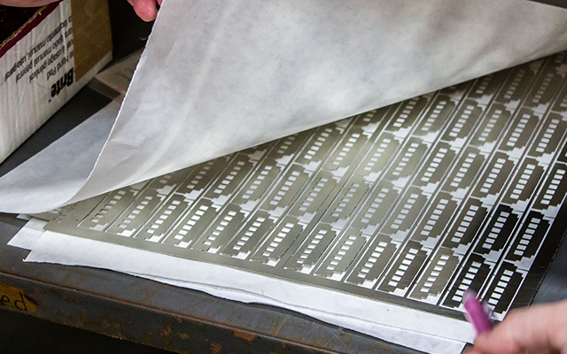 A sheet of nickel silver made using photo etching.