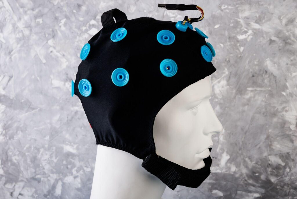 EEG electrodes attached to model head. EEG headset equipment.